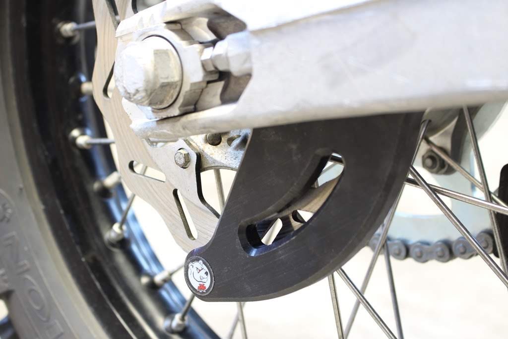 Protezione disco freno posteriore AXP - GASGAS HUSQVARNA KTM SHERCO - Nero